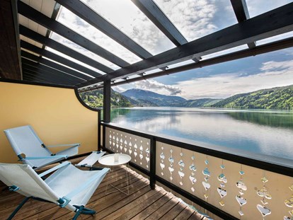 Wanderurlaub - Kärnten - Zimmerbalkon mit direktem Seeblick - Seeglück Hotel Forelle