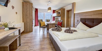Wanderurlaub - Hohe Tauern - Modern und im Landhausstil eingerichtete Doppel / Familienzimmer laden zum ausschlafen ein - Berghotel Jaga Alm 